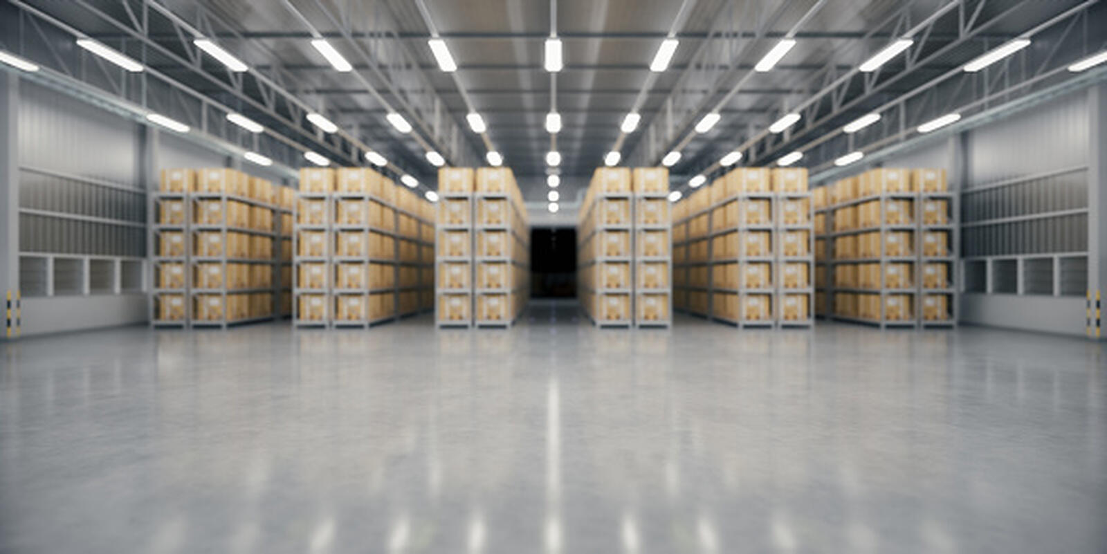 A high-bay warehouse with tall racking and a polished distribution-centre floor