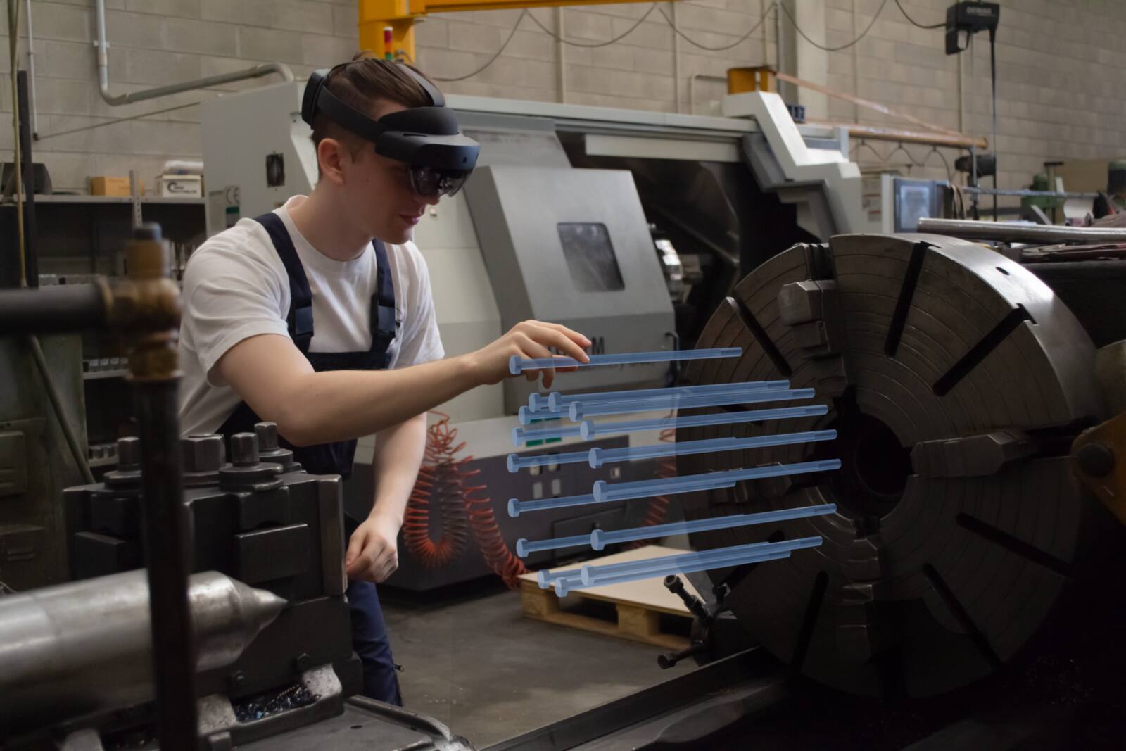 An operator in an AR headset working on equipment with a digital overlay